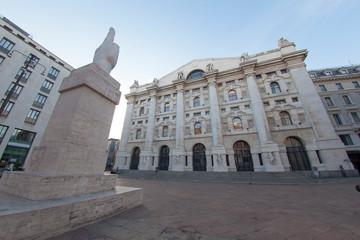 Milan, Italy - June 13, 2017: street view of Piazza Affari, the financial and economics center of Milan. Shot is taken at sunset, the streets are empty.