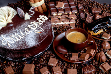Still-life. Chocolate. Candies. Chocolate cake. Cinnamon. Coffee.