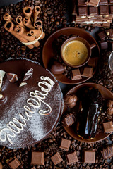 Still-life. Chocolate. Candies. Chocolate cake. Cinnamon. Coffee.
