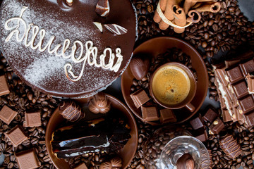 Still-life. Chocolate. Candies. Chocolate cake. Cinnamon. Coffee.
