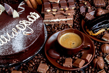 Still-life. Chocolate. Candies. Chocolate cake. Cinnamon. Coffee.