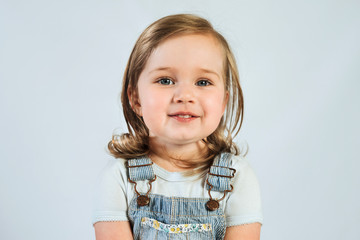 Portrait of 2 year old happy smiling baby on white background. 