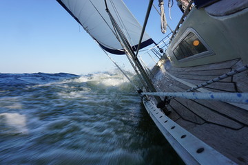 Sailing on a sailing boat with wind, waves and tube water.