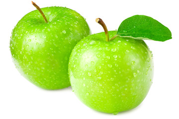 green apples with green leaves isolated on white background