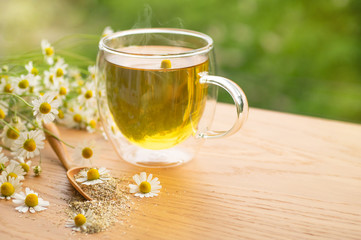 Chamomile flowers and chamomile tea. Herbal chamomile tea. Close-up.