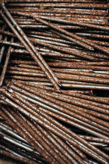 Scrap metal. Box with old rusty nails. Close-up. Macro.