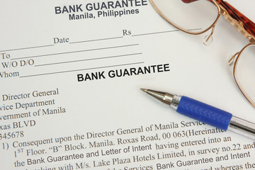 A bank guarantee with ballpen and contract