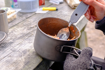 Delicious coarse noodles with tomato paste. Holidays in the outdor