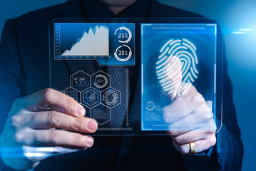 The abstract image of the businessman use a thumb scanning during sun shining. the concept of...