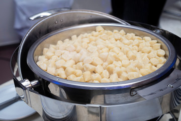 
fresh pasta displayed on stainless steel fountains at event