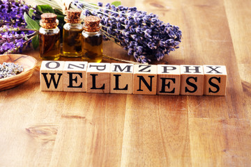 lavender herbal oil and lavender flowers. bottle of lavender massage oil for aromatherapy treatment...