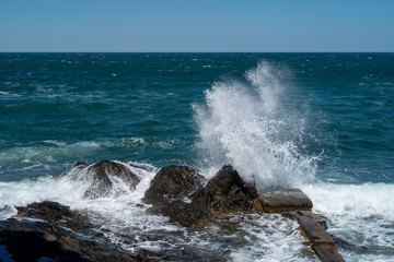 waves crashing on rocks