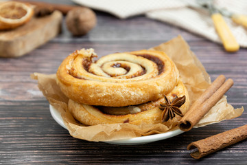 Cinnamon roll close up, danish pastry, sweet pastry for breakfast or snack.