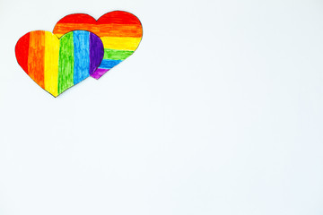 Two hearts in LGBT flag colors on white background. Romantic gay community dating.