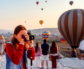 Girl taking photo in Cappadocia Goreme