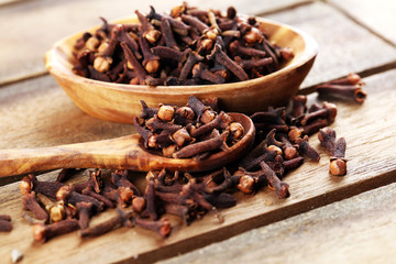 freshly dryed cloves spice texture on background