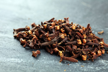 freshly dryed cloves spice texture on background