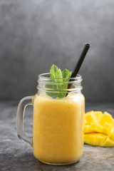 Summer mango and pineapple smoothie. Fresh fruit yellow smoothie.