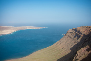 Fototapeta na wymiar Aerial view on the coastline of Lanzarote island on a sunny day 
