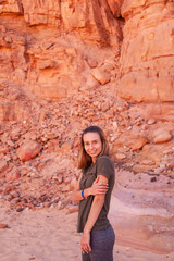 Beautiful girl on a background of nature of Egypt. Portrait photo of a girl traveler. In the...