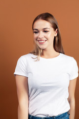 Obraz premium young pretty blond woman with fresh natural makeup posing cheerful on browm background, lifestyle people concept