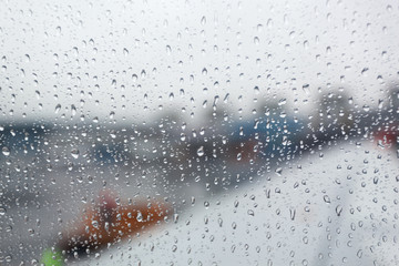 Rain drops on airplane window