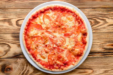 Delicious italian pizza served on wooden table