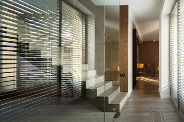 Glass wall in home corridor
