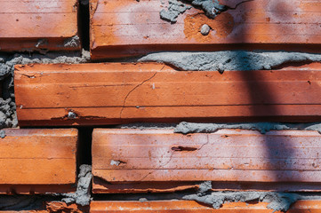 red brick wall with cement