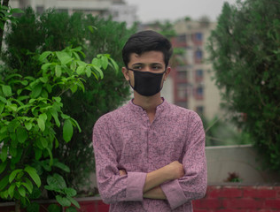 Arabian man wears mask to prevent covid 19.Iranian infected man wears safety face mask.Mask prevents corona virus and air pollution dust.New type coronavirus.
