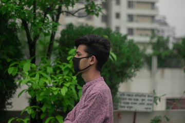 Arabian man wears mask to prevent covid 19.Iranian infected man wears safety face mask.Mask prevents corona virus and air pollution dust.New type coronavirus.