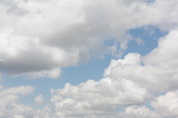 Blue sky with many background clouds