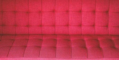 Texture of red cloth sofa.