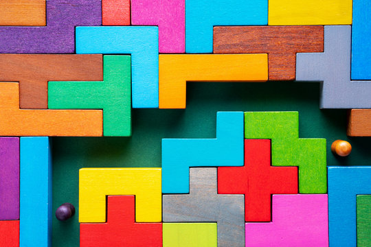 People in the maze, finding a way out. The concept of a business strategy, analytics, search for solutions, the search output. Labyrinth of colorful wooden blocks.