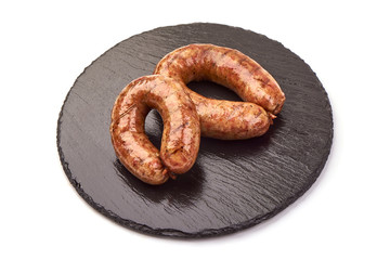 British grilled pork sausages, isolated on white background