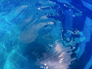 water surface in a blue barel. water texture