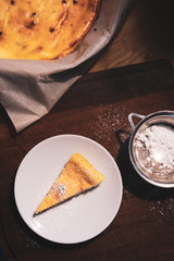 slice of ricotta cheese pie, pine nuts and chocolate chips. breakfast with a slice of cake.