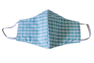 Handmade face masks made from plaid cloth placed green  isolated on white background with clipping path, washable and reusable, can be used during shortage to corona virus pandemic. virus covid-19.