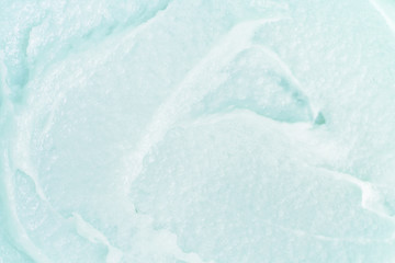 Obraz premium Сlose-up texture of a macro body cosmetic with a creamy blue scrub consistency. Beauty cosmetology macro background with copyspace.