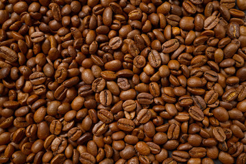 Texture of coffee beans. Roasted coffee beans background. close up Coffee beans