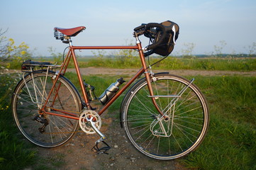 Fototapeta na wymiar Traditionally racing bike on a summer's evening. 