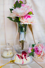 Still-life. Ice-cream Ice-cream with jam. Peonies. Sweets.