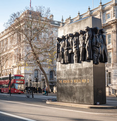 Monument to the Women of World War 2. Memorial on Whitehall, London, with background government buildings including Downing Street and Foreign Office. - 351279540
