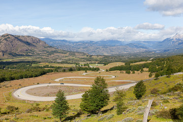 View of the curved asphalt road trough mountains. Carretera Austral road near the Cerro Castillo National Park. Chile