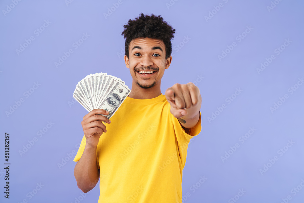 Sticker Photo of man holding dollars and pointing finger at camera