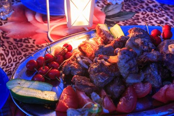 Grilled meat on the setting
table for dinner
