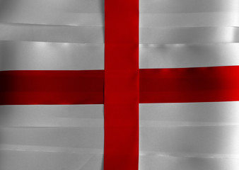 Fototapeta premium Colorful ribbon as England national flag, red centred cross on a white.
