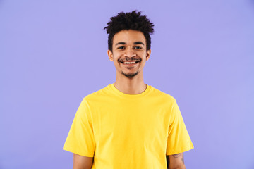 Photo of funny african american man smiling and looking at camera