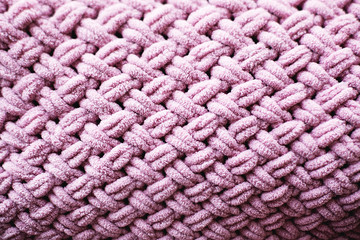 Texture of pink knit blanket. Plaid merino wool.