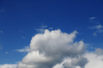 Unique texture of blue clear sky with a light cloud.